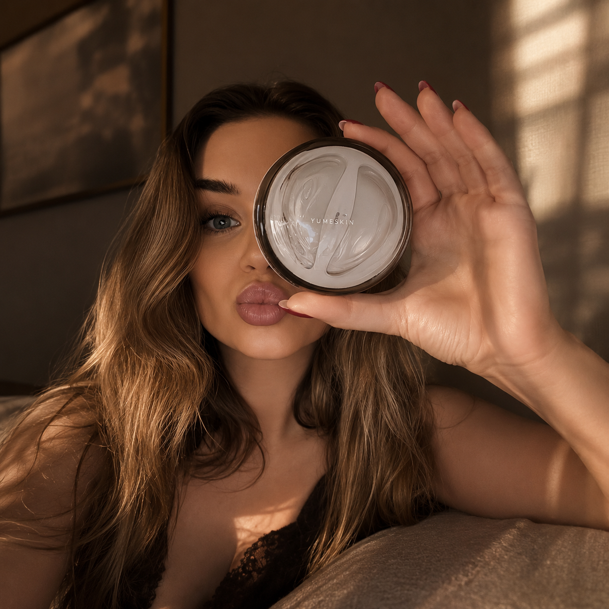 yumeskin. model holding YUMESKIN eye patches case